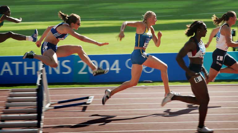 Carolina Klüft under häckloppet i Aten 2004. Foto: TT